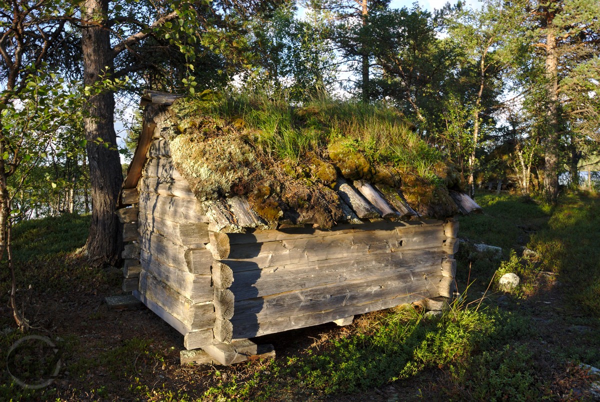 Old wooden storage building close to the lake