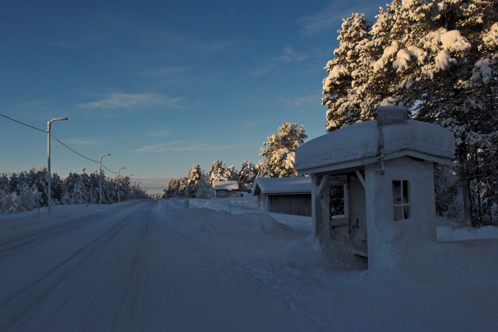 snow covered bus stop