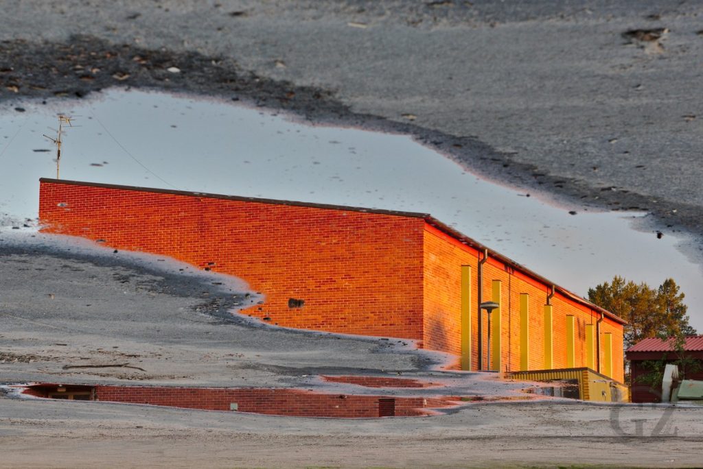 Reflections of building in pond