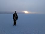 ice skater on frozen lake