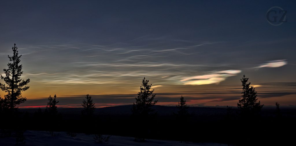 wave shaped clouds in spectral colors