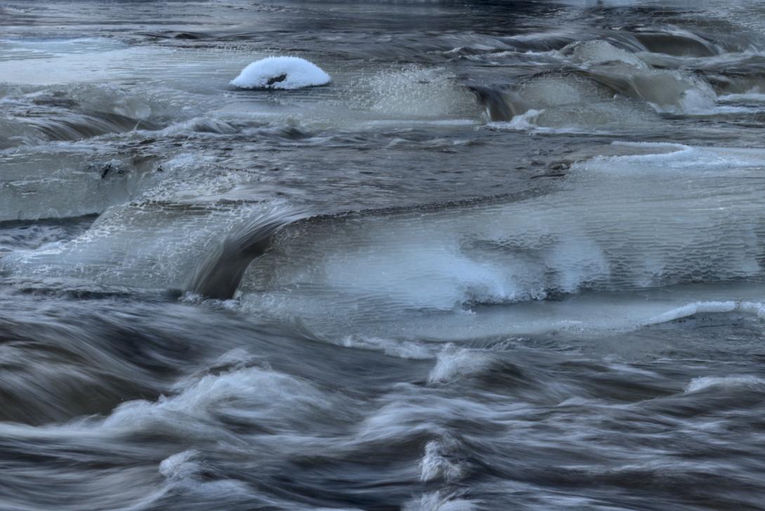 Freezing Rapid rapid with ice covered stones